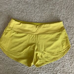 Lululemon low rise speed up shorts.  2.5 inch inseam in yellow.  Size 6.